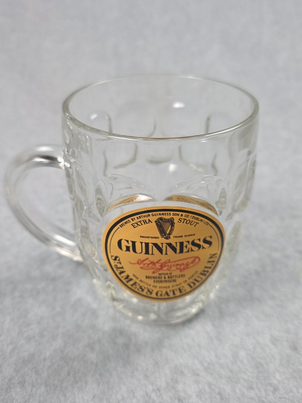 Guinness Clear Glass Mug with Gold and Black Crest